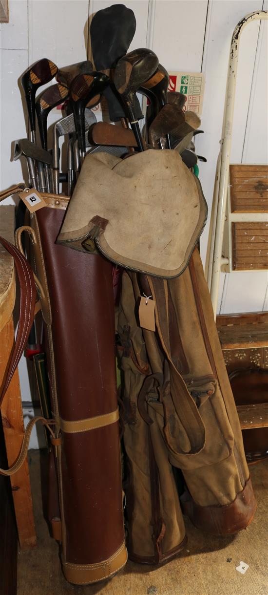 37 old golf clubs in three old golf bags